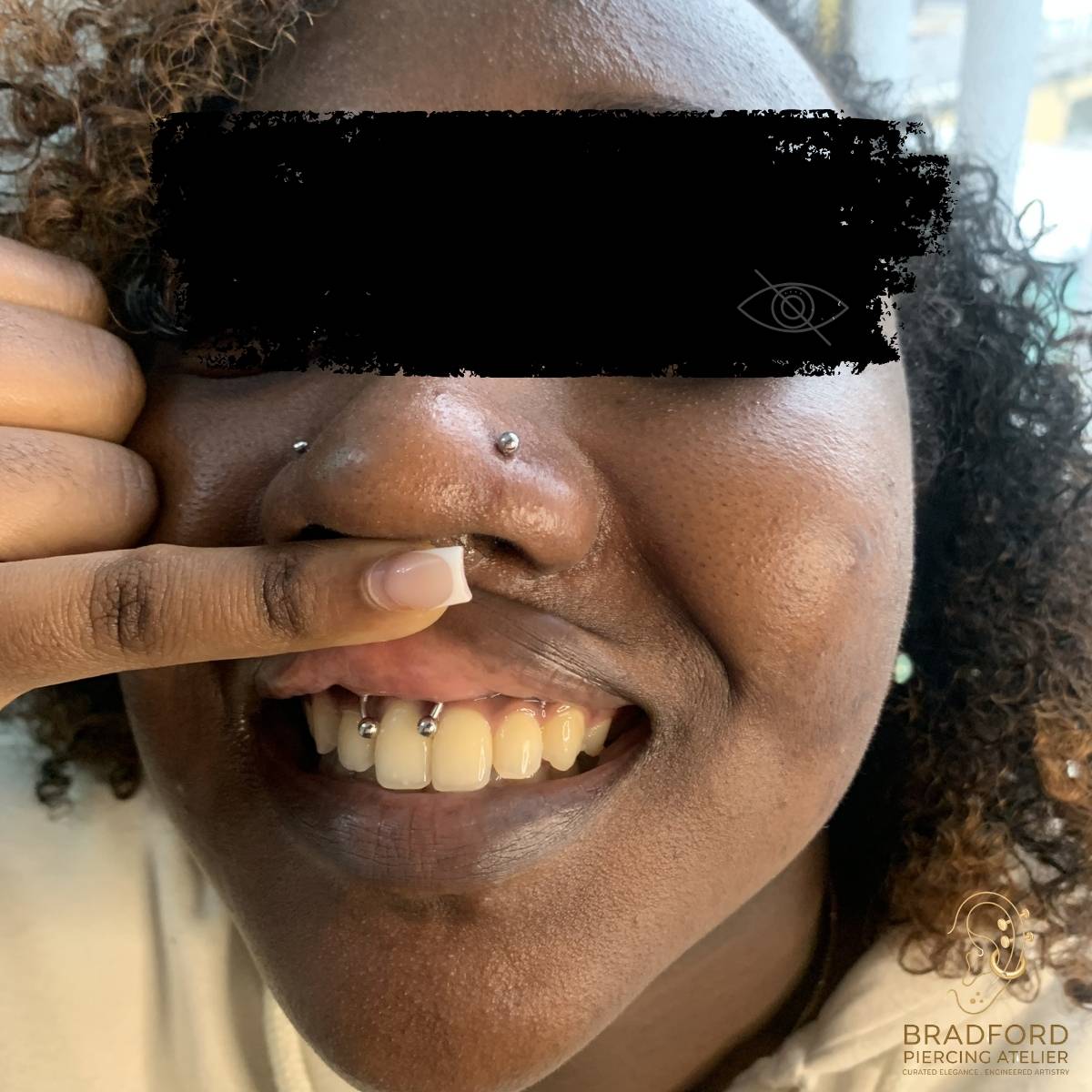 Multiple nose piercings and smiley